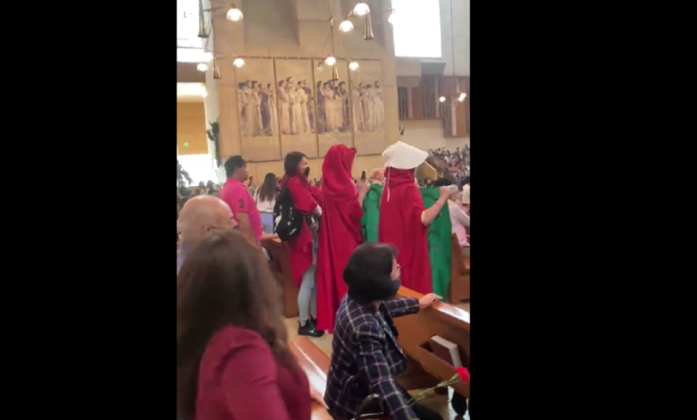 dressed-as-handmaids,-pro-abortion-activists-invade-mother's-day-mass-in-los-angeles